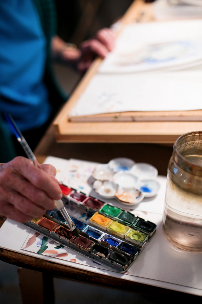 Older painter uses artist's palette