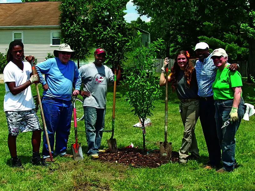 Senior Living residents and staff work toward sustainability goals by planting trees