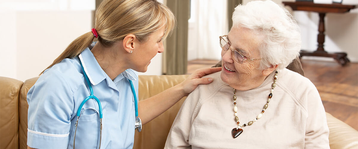 Nurse talks with resident