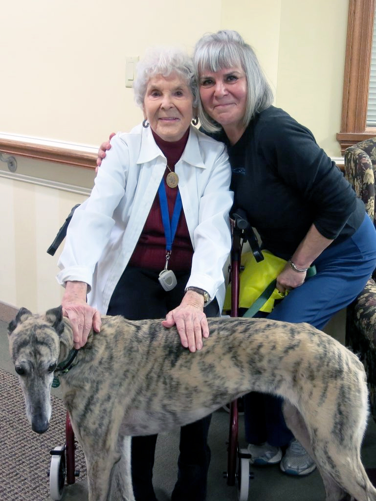 Mom and daughter with pet greyhound