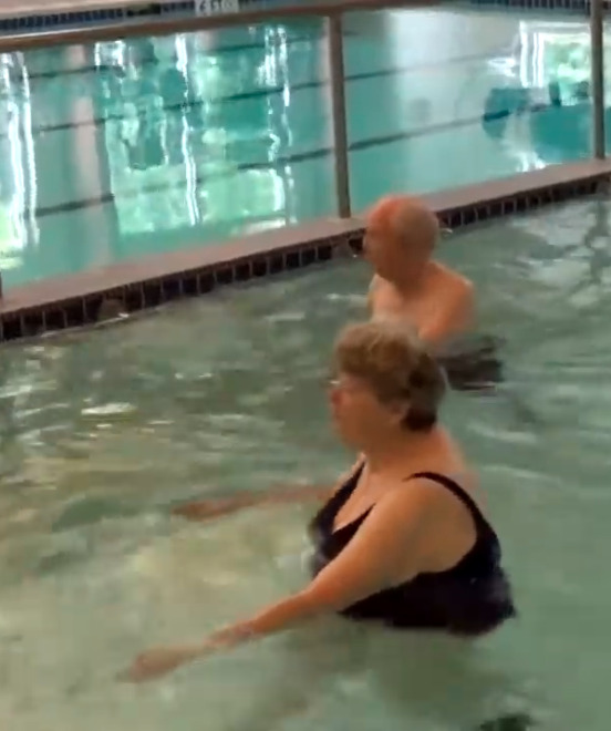 Seniors participating in water tai chi, an example of mindfulness in retirement communities