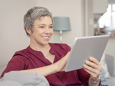 Woman holding iPad and reading