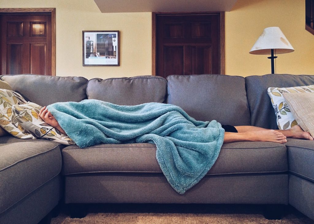 person napping on sofa