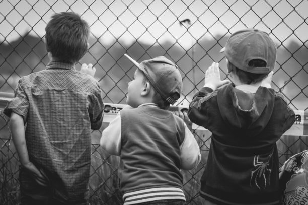 boys looking at baseball field