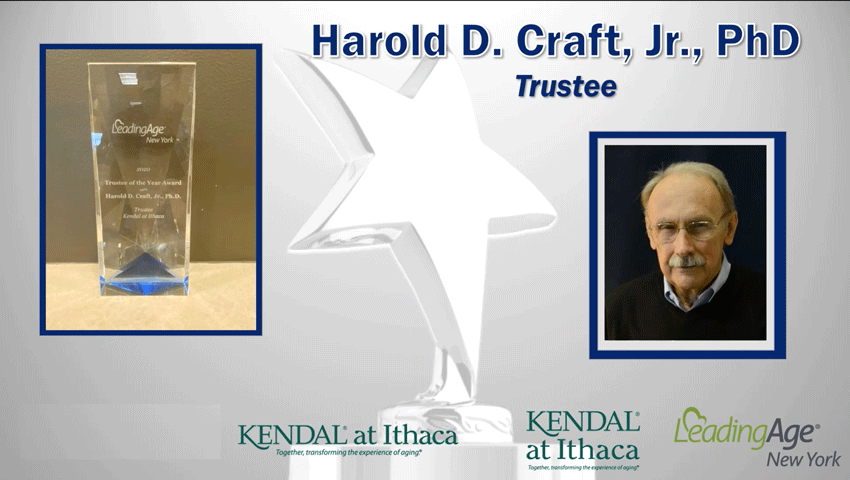 Trustee of the Year award trophy alongside photo of Hal Craft