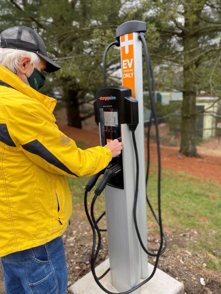 Senior Living resident uses sustainable car charging station