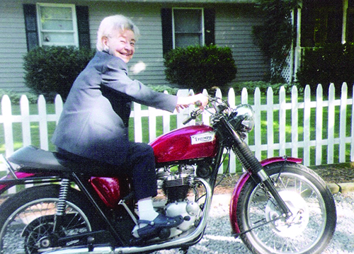 Life Plan at home member rides motorcycle