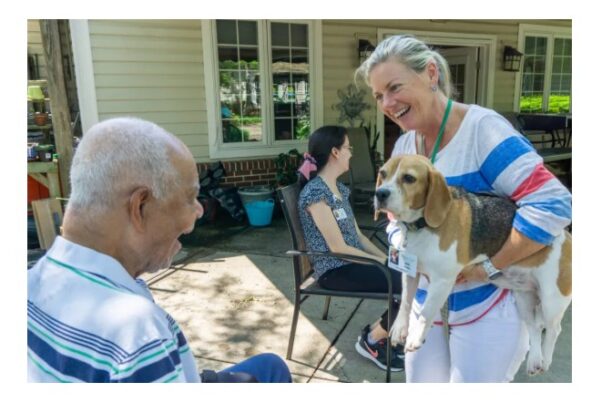Ariel the dog with resident and woman