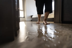 elderly woman in danger of hazard wet floor