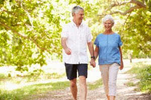 Senior couple walking on a path