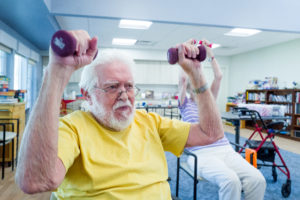man lifting weights